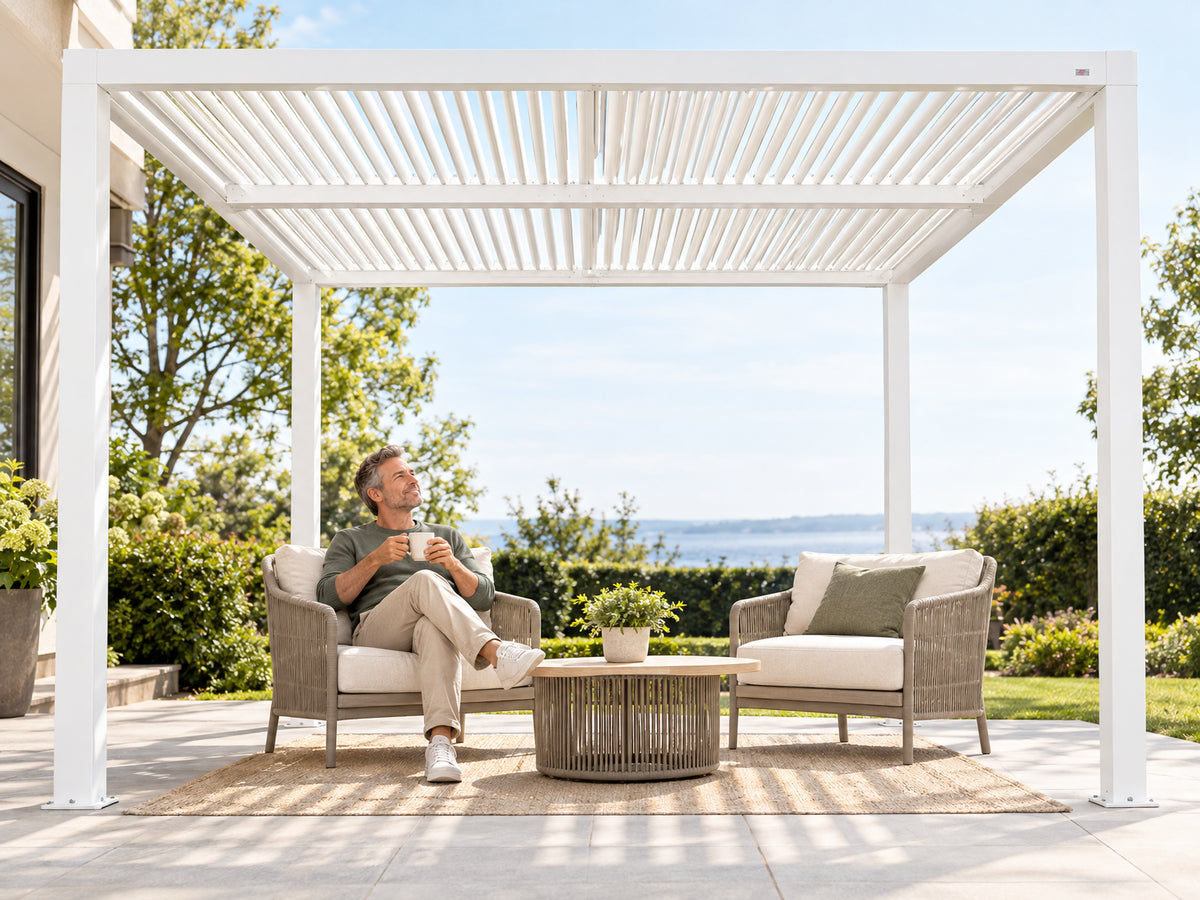 Louvered Pergola Modern White Pergola, man relaxing under the pergola with a coffee, completely at ease